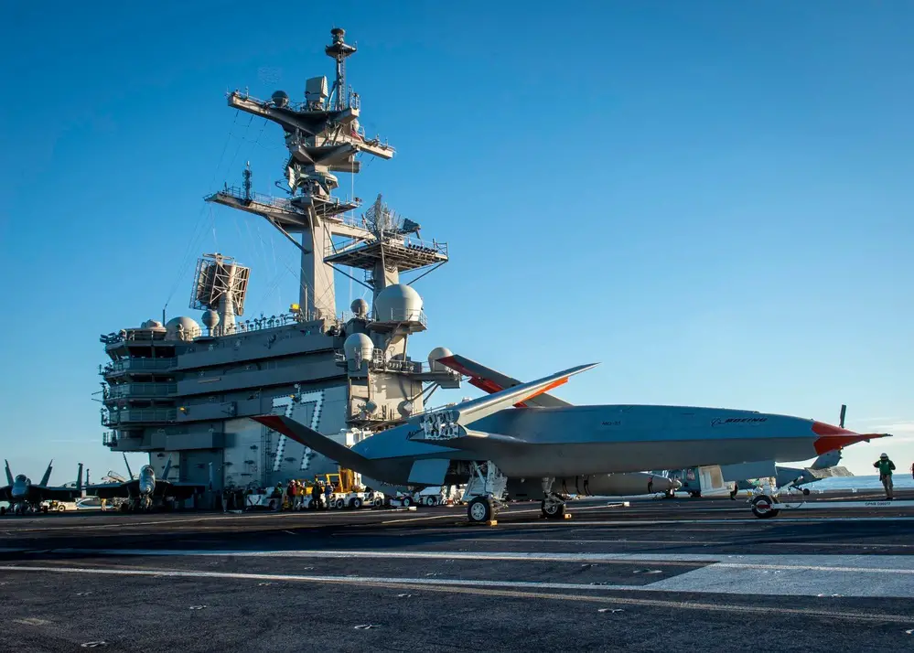 A Boeing unmanned MQ-25 aircraft is given operating directions on the flight deck aboard the aircraft carrier USS George H.W. Bush (CVN 77). The MQ-25 will be the world’s first operational, carrier-based unmanned aircraft and is integral to the Air Wing of the Future Family of Systems (AWotF FoS). 