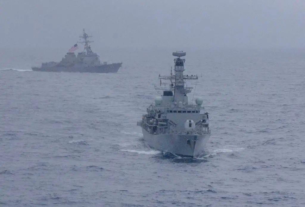 USS McCampbell and HMS Argyll maneuver during a divisional tactics exercise. 