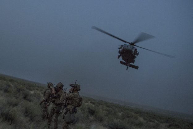 An HH-60G Pave Hawk helicopter flies above Special Tactics Airmen with the 17th Special Tactics Squadron during Jaded Thunder at Mountain Home Air Force Base, Idaho, Aug. 20, 2018. Special Tactics is U.S. Special Operation Commandâ€™s tactical air and ground integration force, and the Air Forceâ€™s special operations ground force, leading global access, precision strike, personnel recovery and battlefield surgery operations. (U.S. Air Force photo by Tech. Sgt. Sandra Welch)