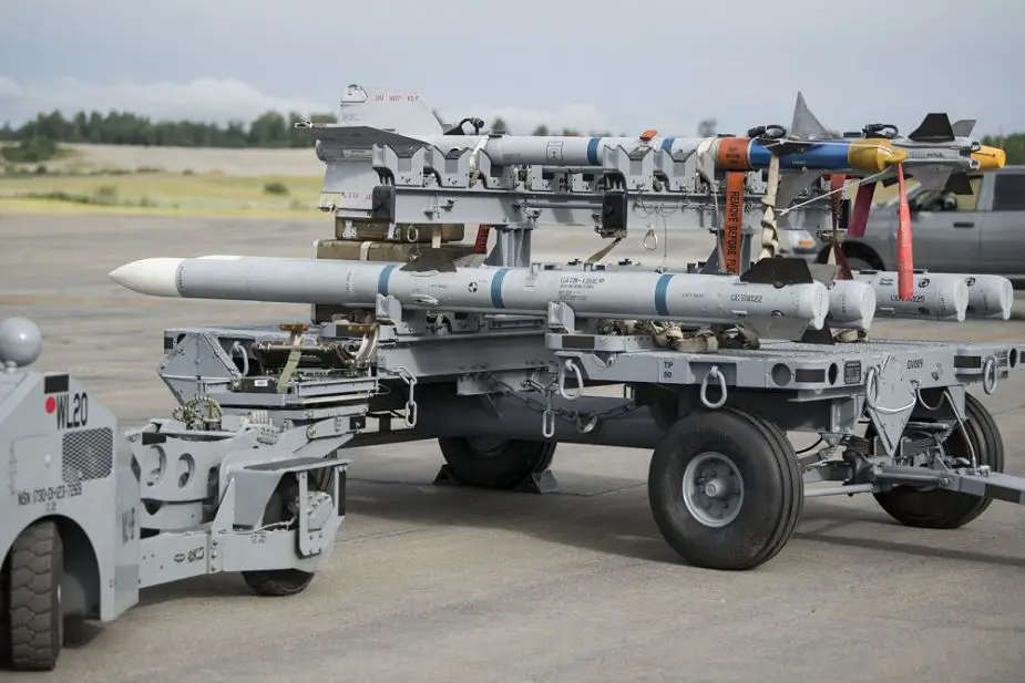 A munitions load truck containing Air Intercept Missile-120 Advanced Medium Air-to-Air Missiles AMRAAM and Air Intercept Missile-9 Sidewinders is used for an F-22 Raptor weapons load training