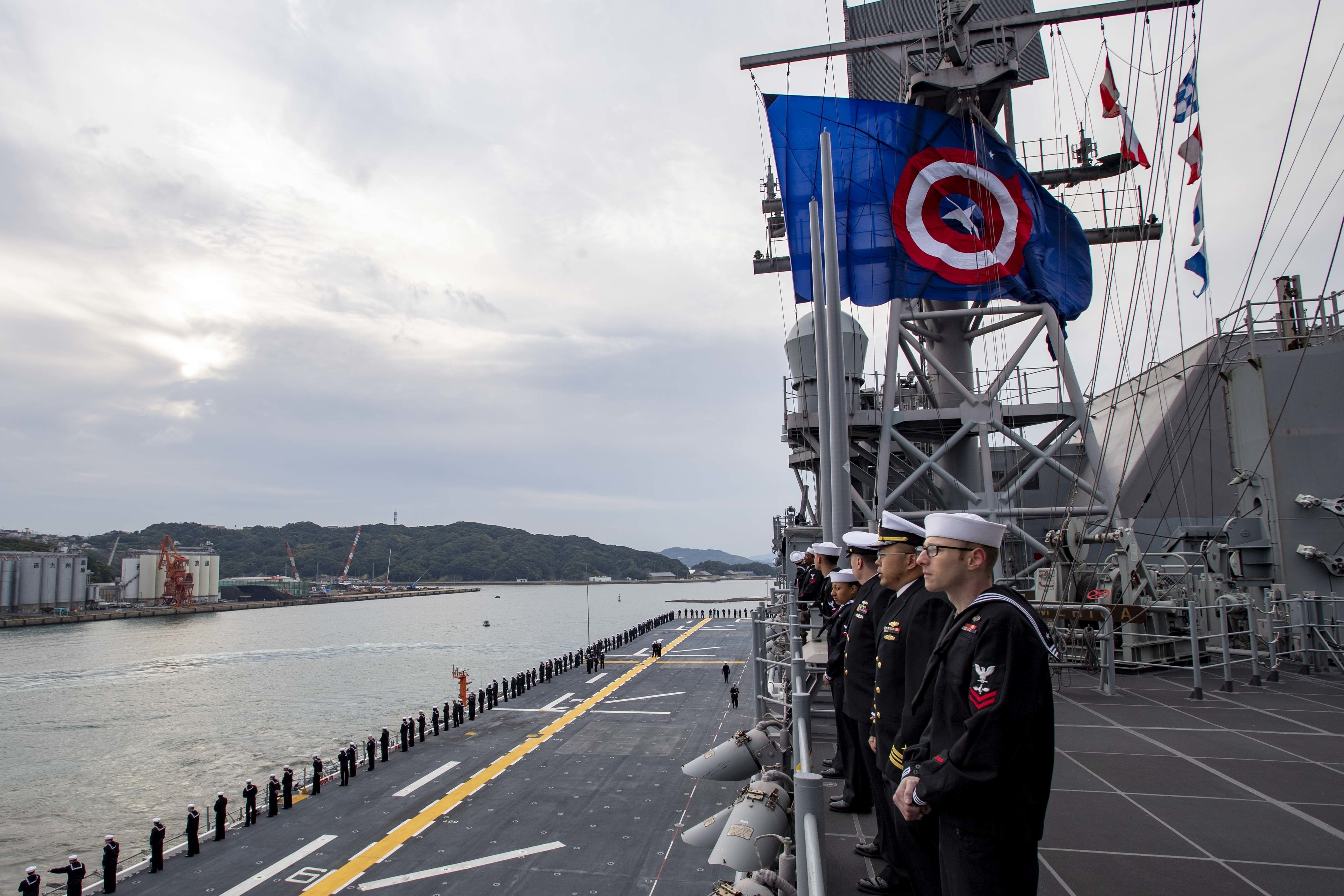  Sailors man the rails as the America-class amphibious assault ship USS America (LHA 6) arrives at Sasebo, Japan to join the forward deployed naval forces.