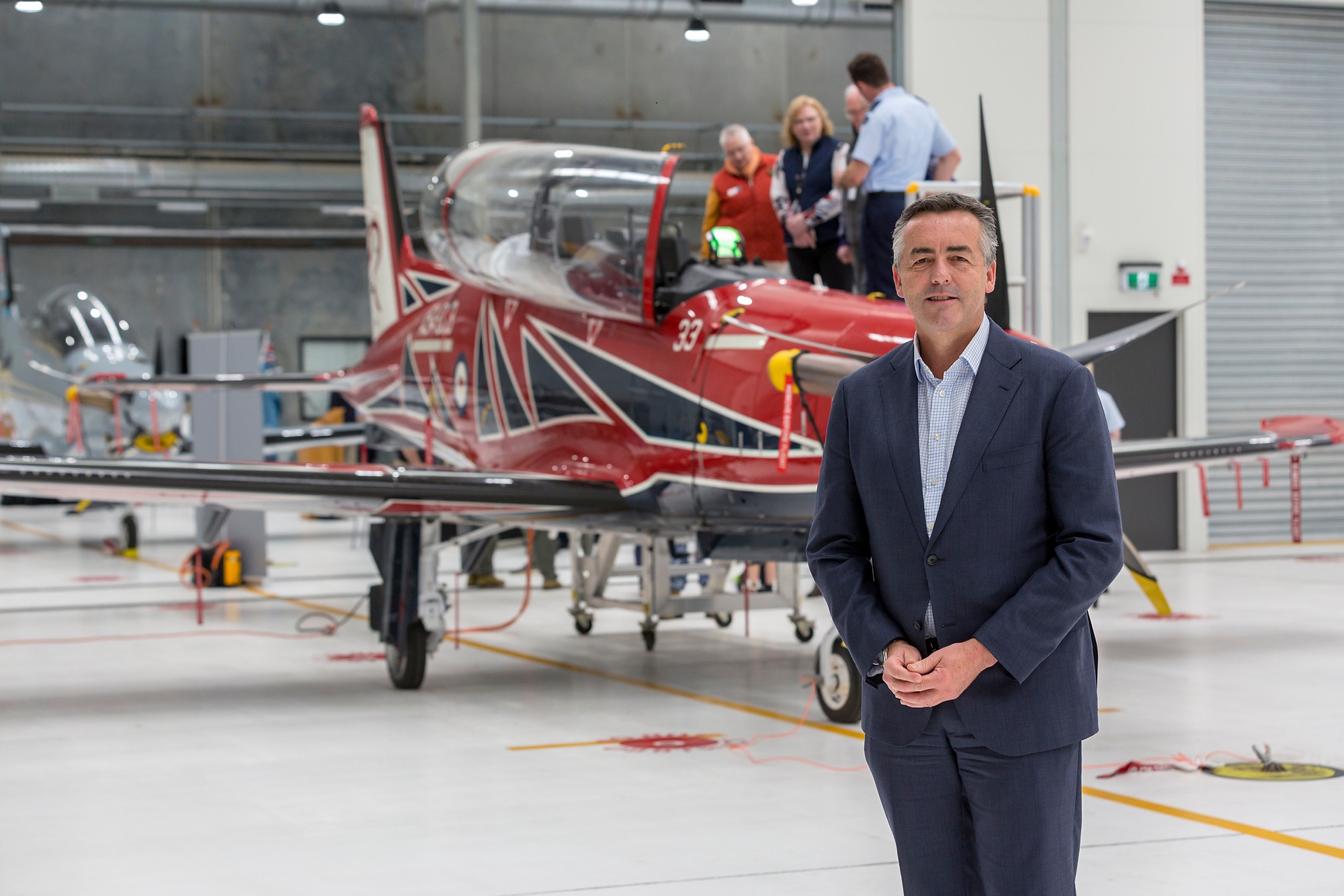 Minister for Veterans and Defence Personnel, the Hon. Darren Chester MP in front of a new RAAF Pilatus PC-21 during the final delivery ceremony at RAAF Base East Sale. 