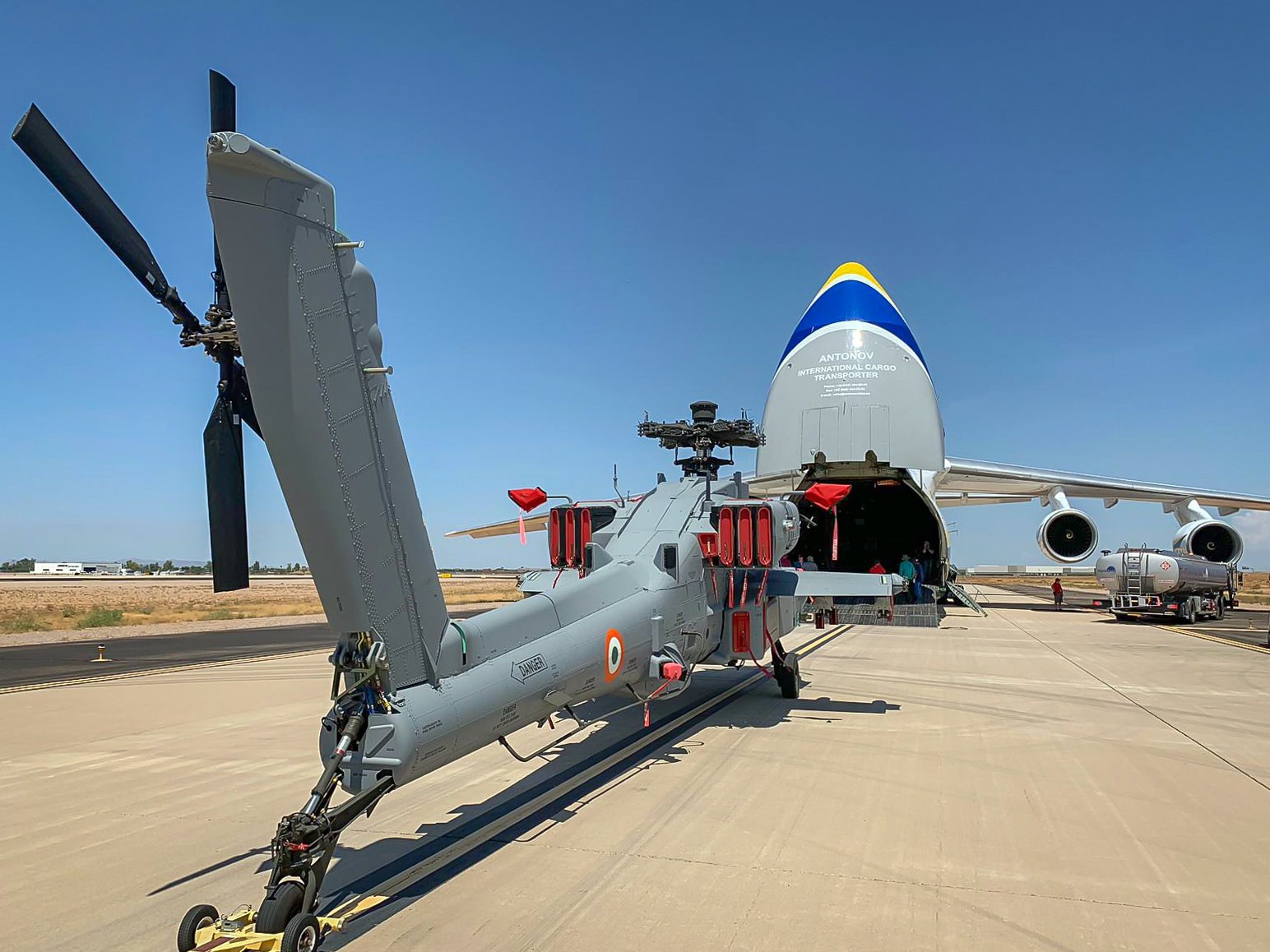 Boeing has contracted Ukraine's Antonov Airlines to transport its AH-64 Apache attack helicopters to India. An An-124 is shown here loading an Apache painted in Indian Air Force markings at Boeing's plant in Phoenix, Arizona. 