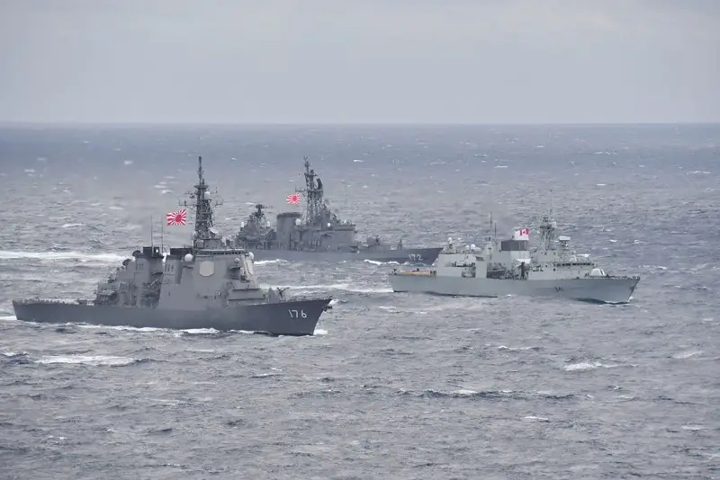 HMCS Ottawa conducts manoeuvres with Japanese Maritime Self-Defense Force ships Chokai and Shimakaze during exercise KAEDEX in October 2019.