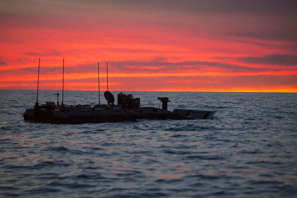 U.S. Marines with Amphibious Vehicle Test Branch, Marine Corps Tactical Systems Support Activity, take a new Amphibious Combat Vehicle out for open ocean low-light testing at Del Mar Beach on Marine Corps Base Camp Pendleton, California, Dec. 17, 2019. The test was designed to assess and verify how well Marines can interface with the vehicle and operate at night. The ACV is an eight-wheeled armored personnel carrier designed to fully replace the Corps' aging fleet of Amphibious Assault Vehicles. (U.S. Marine Corps photo by Lance Cpl. Andrew Cortez)