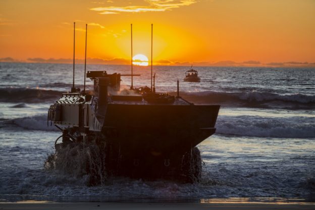 U.S. Marines with Amphibious Vehicle Test Branch, Marine Corps Tactical Systems Support Activity, drive a new Amphibious Combat Vehicle ashore during low-light surf transit testing at AVTB Beach on Marine Corps Base Camp Pendleton, California, Dec. 18, 2019. The test was designed to assess and verify how well Marines can interface with the vehicle and operate at night. The ACV is an eight-wheeled armored personnel carrier designed to fully replace the Corpsâ€™ aging fleet of Amphibious Assault Vehicles. (U.S. Marine Corps photo by Lance Cpl. Andrew Cortez)