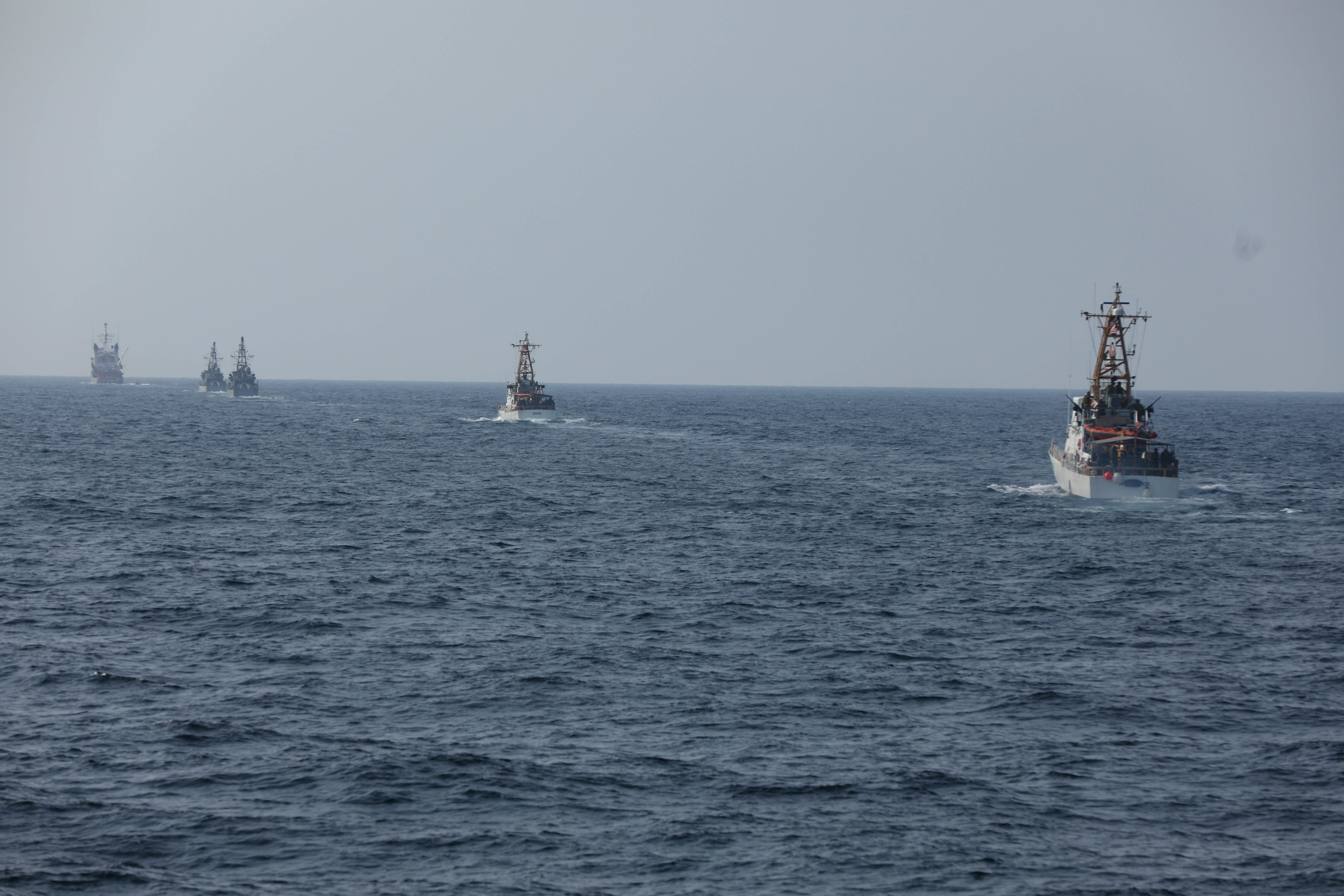 U.S. Navy and Coast Guard ships sail in formation, during Griffin Missile Exercise 19. The exercise demonstrated a proven capability for the ships to defend themselves against small boat threats and ensure maritime security through key chokepoints in the U.S. Central Command area of responsibility. 