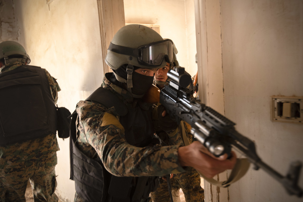 Syrian Democratic Force commando cadets clear a room during military operations in urban terrain training in Syria, Aug. 3, 2019. The SDF have made steady progress, and have adapted to Daesh tactics to continue to pressure them into smaller spaces. (U.S. Army photo by Spc. Alec Dionne)