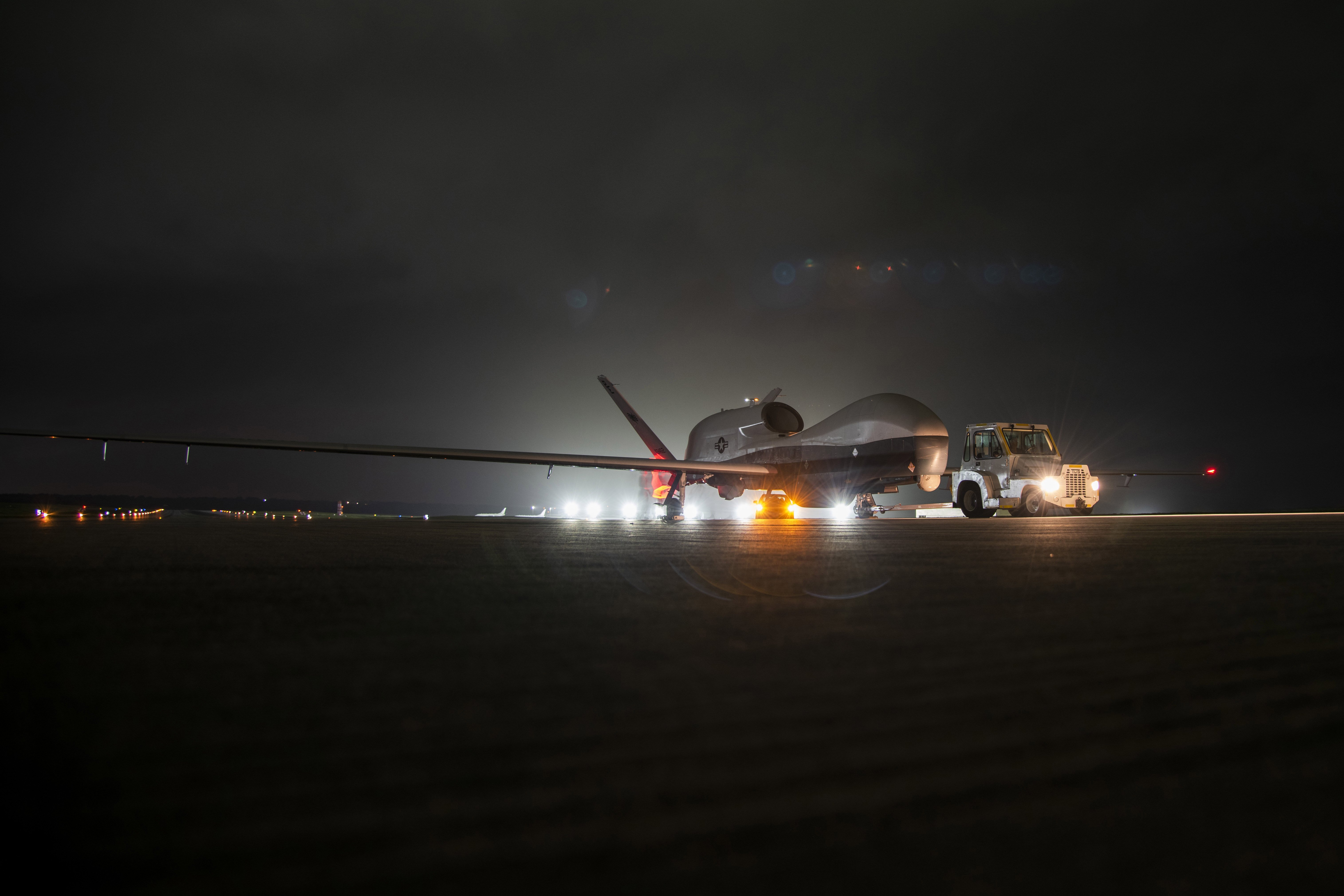 An MQ-4C Triton unmanned aircraft system (UAS) idles on a runway at Andersen Air Force Base, Guam after arriving for a deployment as part of an early operational capability (EOC) test. US Navy Photo