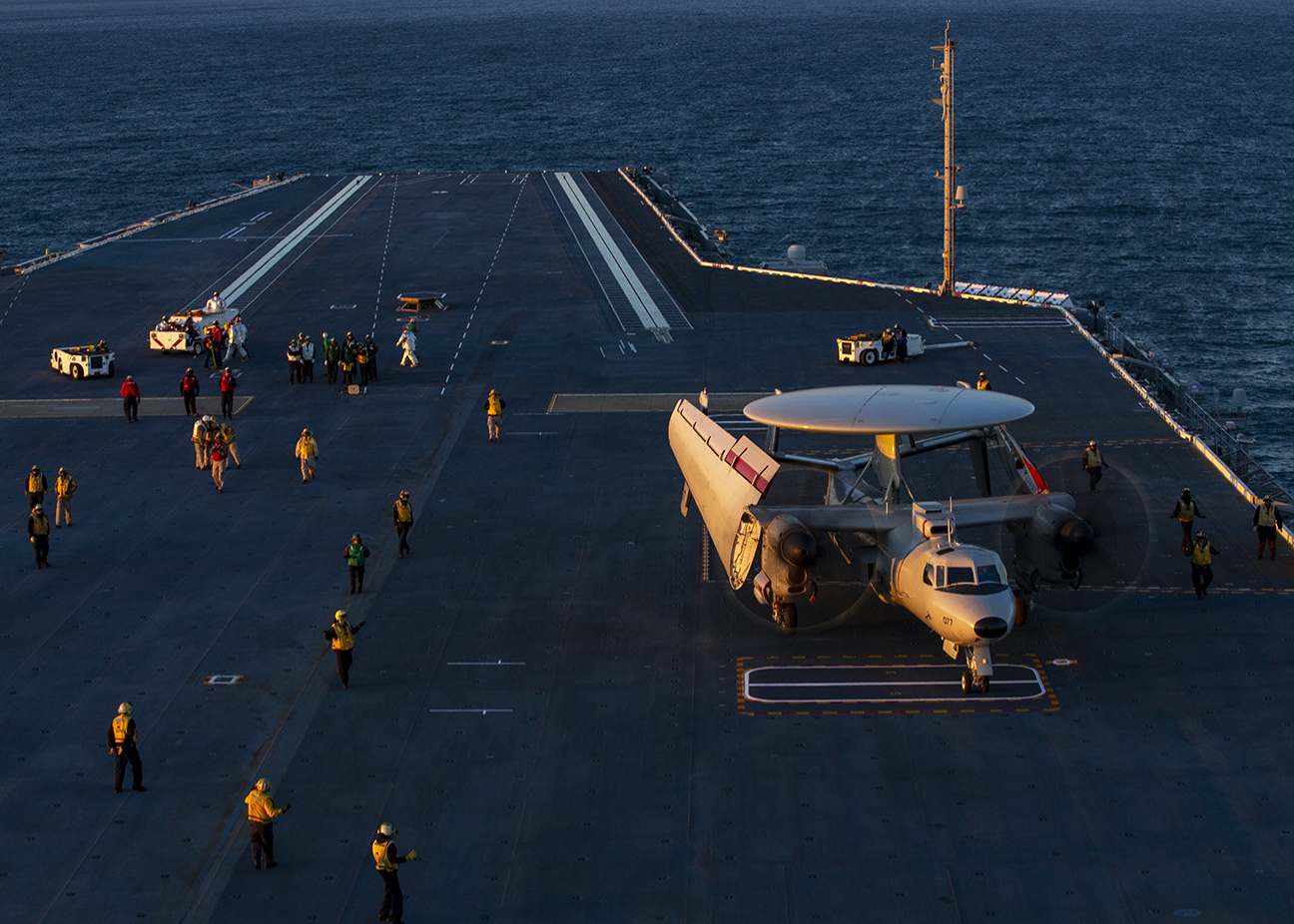 Sailors assigned to the aair department aboard the aircraft carrier USS Gerald R. Ford (CVN 78) direct an E-2D Advanced Hawkeye assigned to Air Test and Evaluation Squadron (VX) 20 on during flight operations. Gerald R. Ford is currently conducting aircraft compatibility testing to further test its electromagnetic aircraft launch systems and advanced arresting gear.