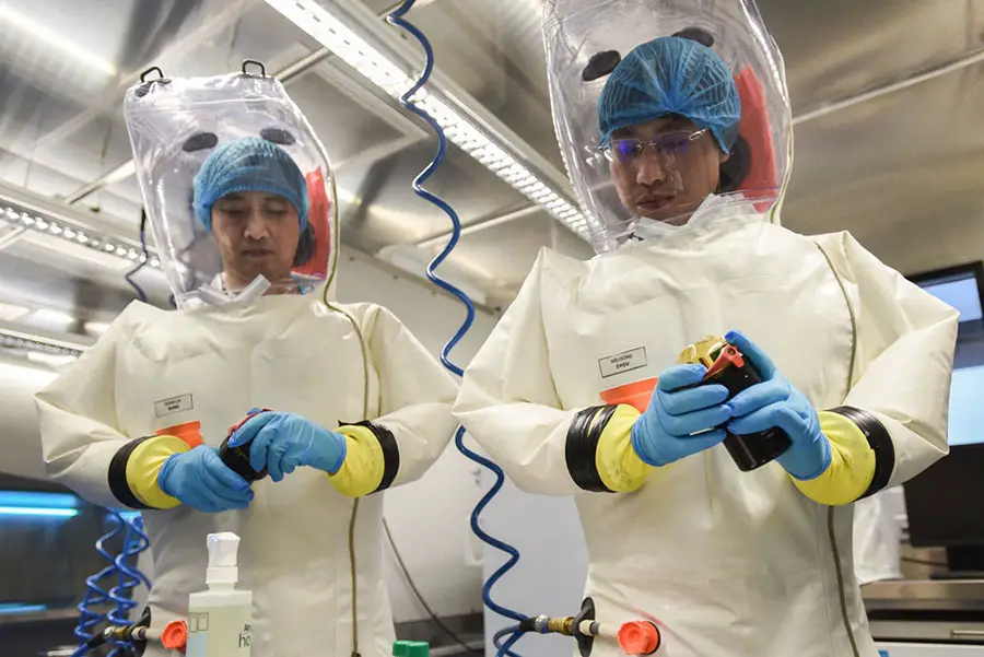 Scientists at the Wuhan Virology Institute wear high-grade hazmat suits. 