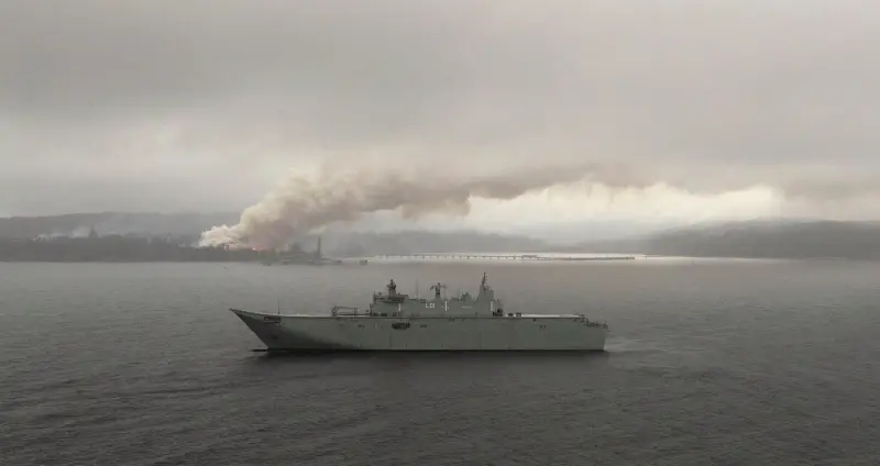 HMAS Adelaide operates off the coast of Eden, NSW as fires still burn out of control during Operation Bushfire Assist.