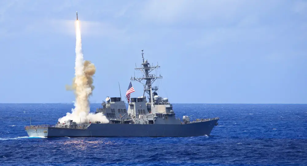 Arleigh Burke-class guided-missile destroyer USS Curtis Wilbur (DDG 54) fires a Standard Missile 2 (SM-2) during a missile firing exercise