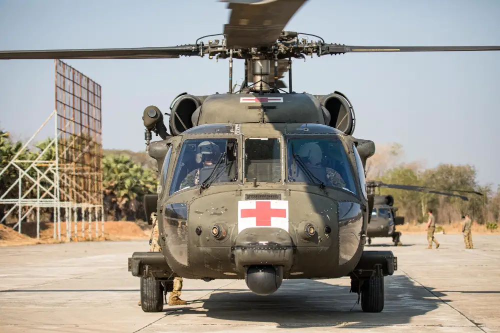 Army aviators from Charlie Company, 3rd Battalion, 25th Aviation Regiment, 25th Combat Aviation Brigade conduct preflight checks during a medevac rehearsal conducted with Soldiers of 2nd Battalion, 35th Infantry Regiment and medical personnel from the Bangkok Ratchasima Hospital
