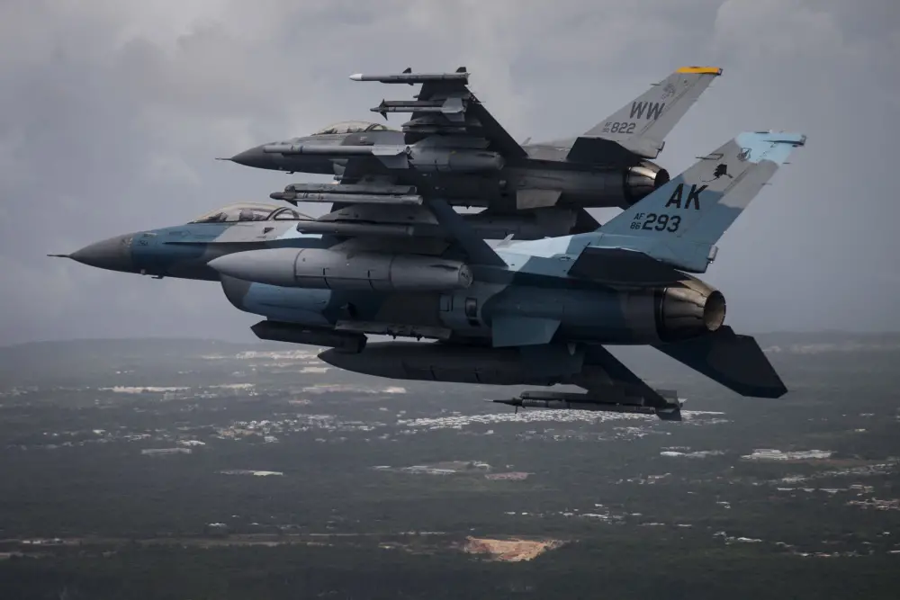A U.S. Air Force F-16C Fighting Falcon, foreground, assigned to the 18th Aggressor Squadron, Eielson Air Force Base, Alaska, and a F-16CJ, assigned to the 14th Fighter Squadron, Misawa Air Base, Japan, approach to land during exercise COPE North 20, at Andersen Air Force Base, Guam, Feb. 19, 2020. (U.S. Air Force photo by Master Sgt. Larry E. Reid Jr.)