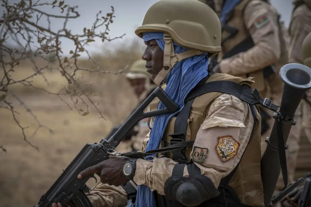 A Burkinabe soldier pulls security before a training patrol during the opening days of Flintlock 20 near Thies, Senegal, Feb. 16, 2020.