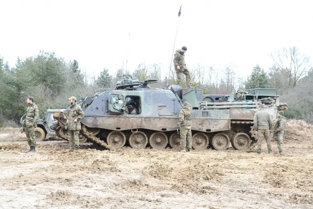 Dutch soldiers stand outside their tank after the end of training exercise Combined Resolve XIII at the Joint Multinational Readiness Center, Hohenfels, Germany.