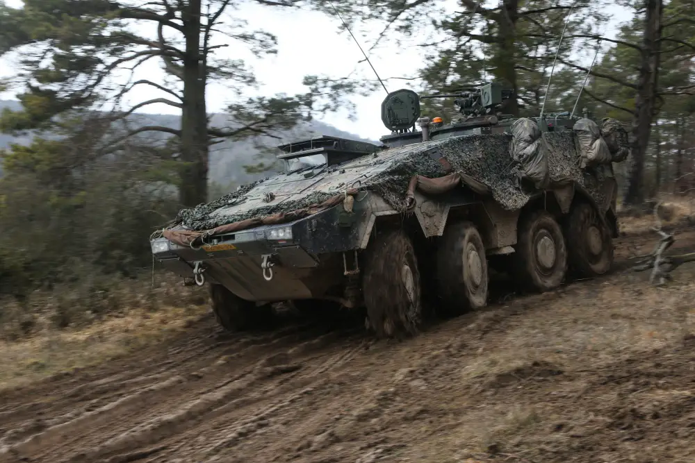 A Dutch GTK Boxer maneuvers through muddy terrain during Combined Resolve XIII at the Hohenfels Training Area in Hohenfels, Germany.