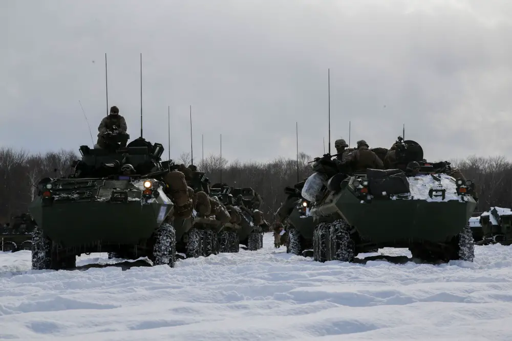 Light Armored Vehicles from 3rd Light Armored Reconnaissance Battalion, Combat Assault Battalion, 3rd Marine Division, prepare to cross the line of departure and begin their comprehensive exercise assault during exercise Northern Viper 2020