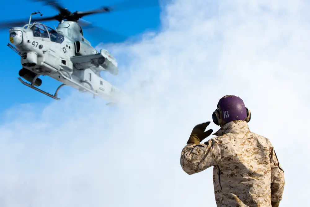 A U.S. Marine Corps AH-1Z Viper with Marine Light Attack Helicopter Squadron 369 Gunfighters prepares to land for hot-loading during exercise Northern Viper
