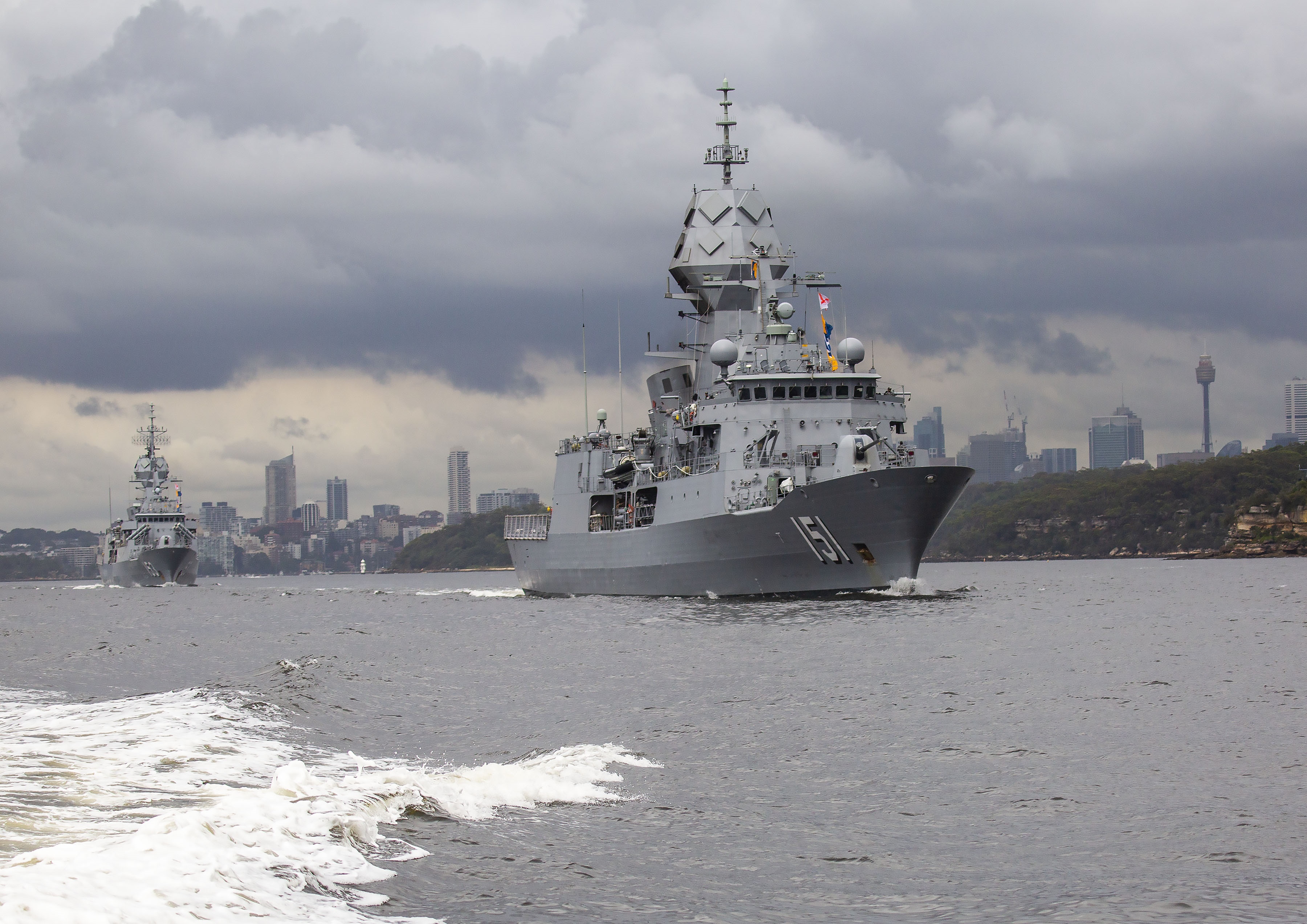 HMAS Arunta followed by HMAS Stuart depart Sydney Harbour for the Royal Australian Navy's Fleet Certification Period, 2020.