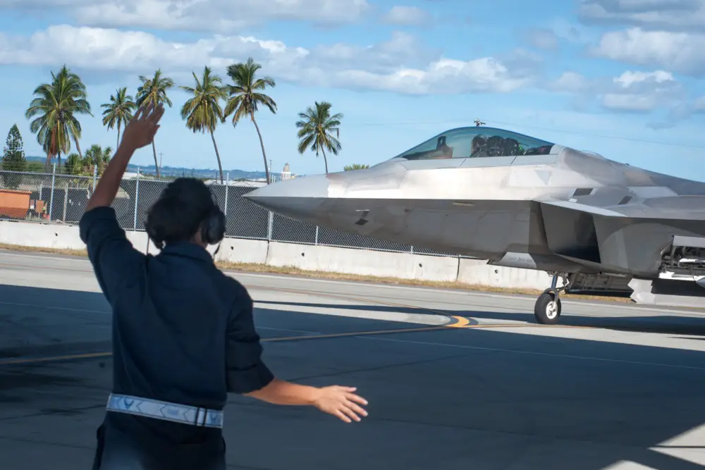 Airman 1st Class Danielle Tubania, 154th Aircraft Maintenance Squadron assistant dedicated crew chief, marshals in an F-22 Raptor Jan. 30, 2020, at Joint Base Pearl Harbor-Hickam, Hawaii. 