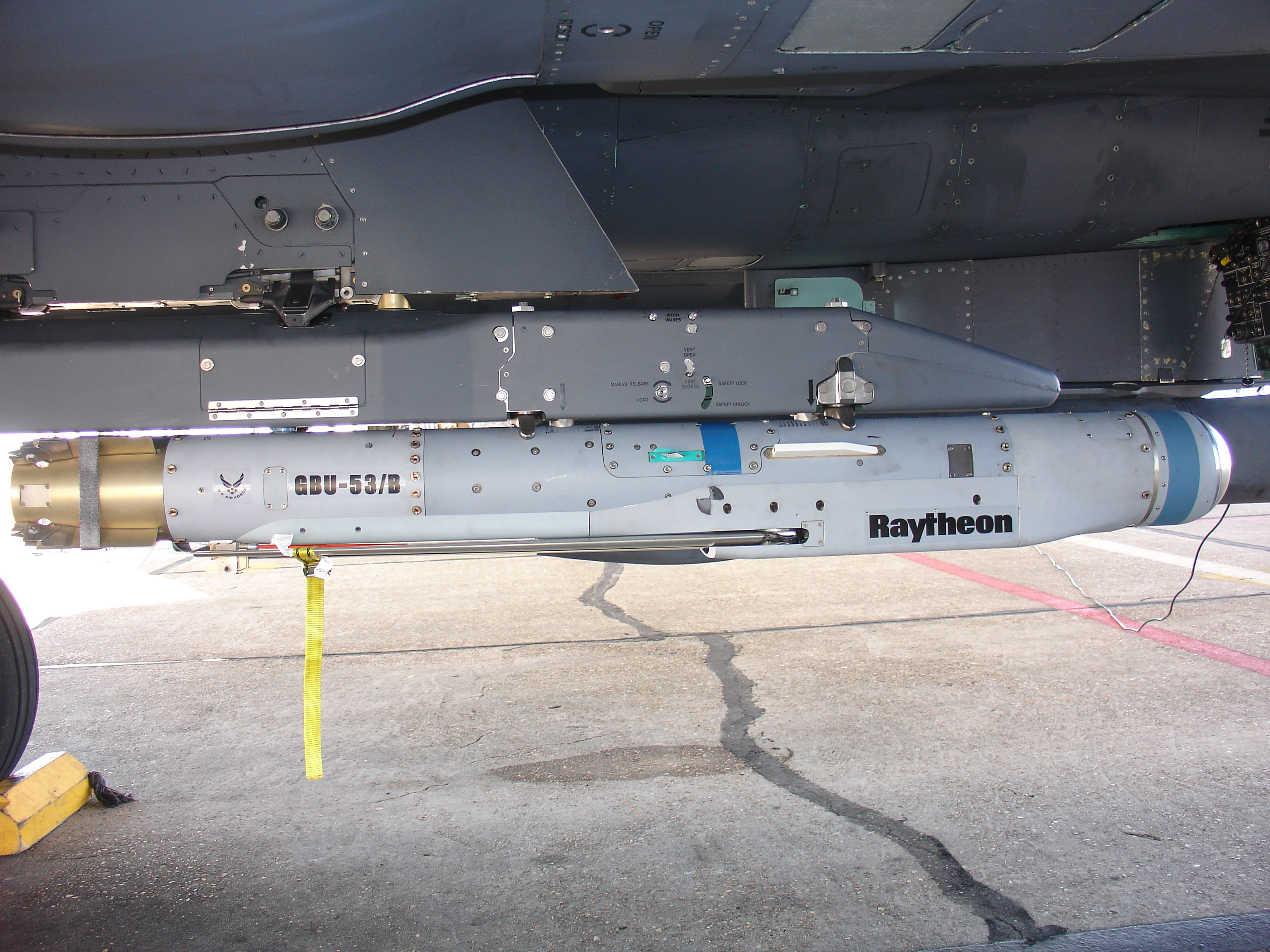 As part of Raytheon's Risk Reduction Program, the StormBreakerâ„¢ smart weapon is loaded on an F-15E aircraft to evaluate deployment and navigation functions. 