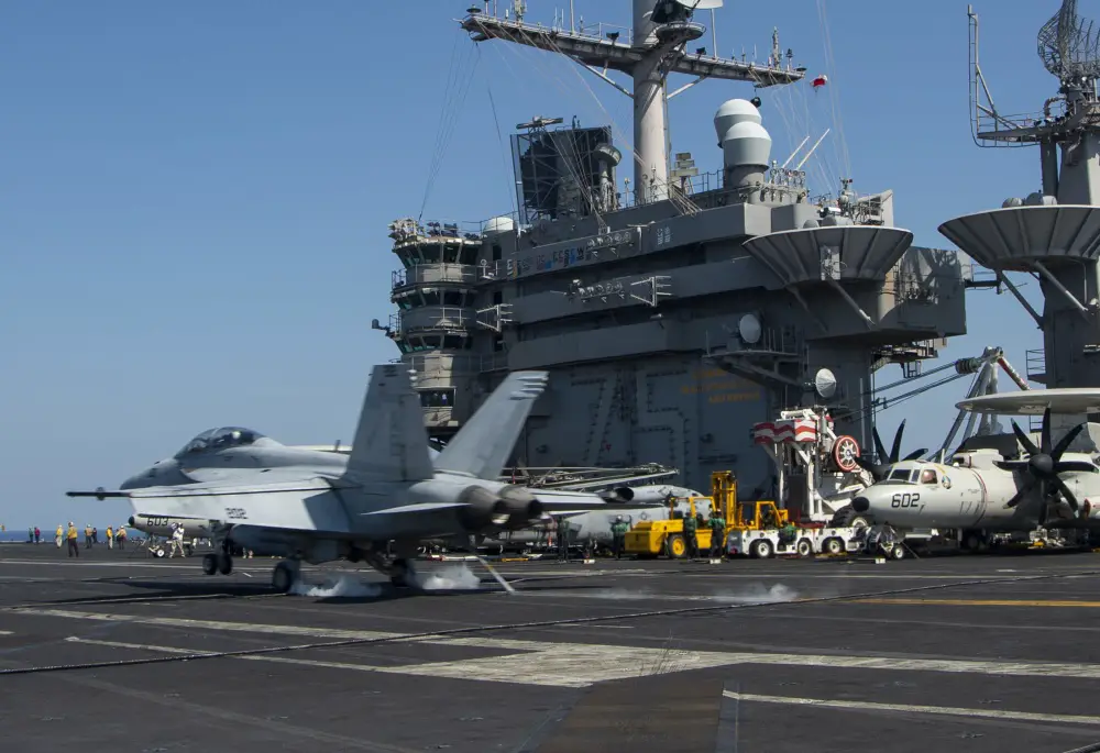 An F/A-18F Super Hornet, attached to the Fighting Checkmates of Strike Fighter Squadron (VFA) 211, lands on the flight deck of the aircraft carrier USS Harry S. Truman (CVN 75) in the Arabian Sea Feb. 1, 2020.