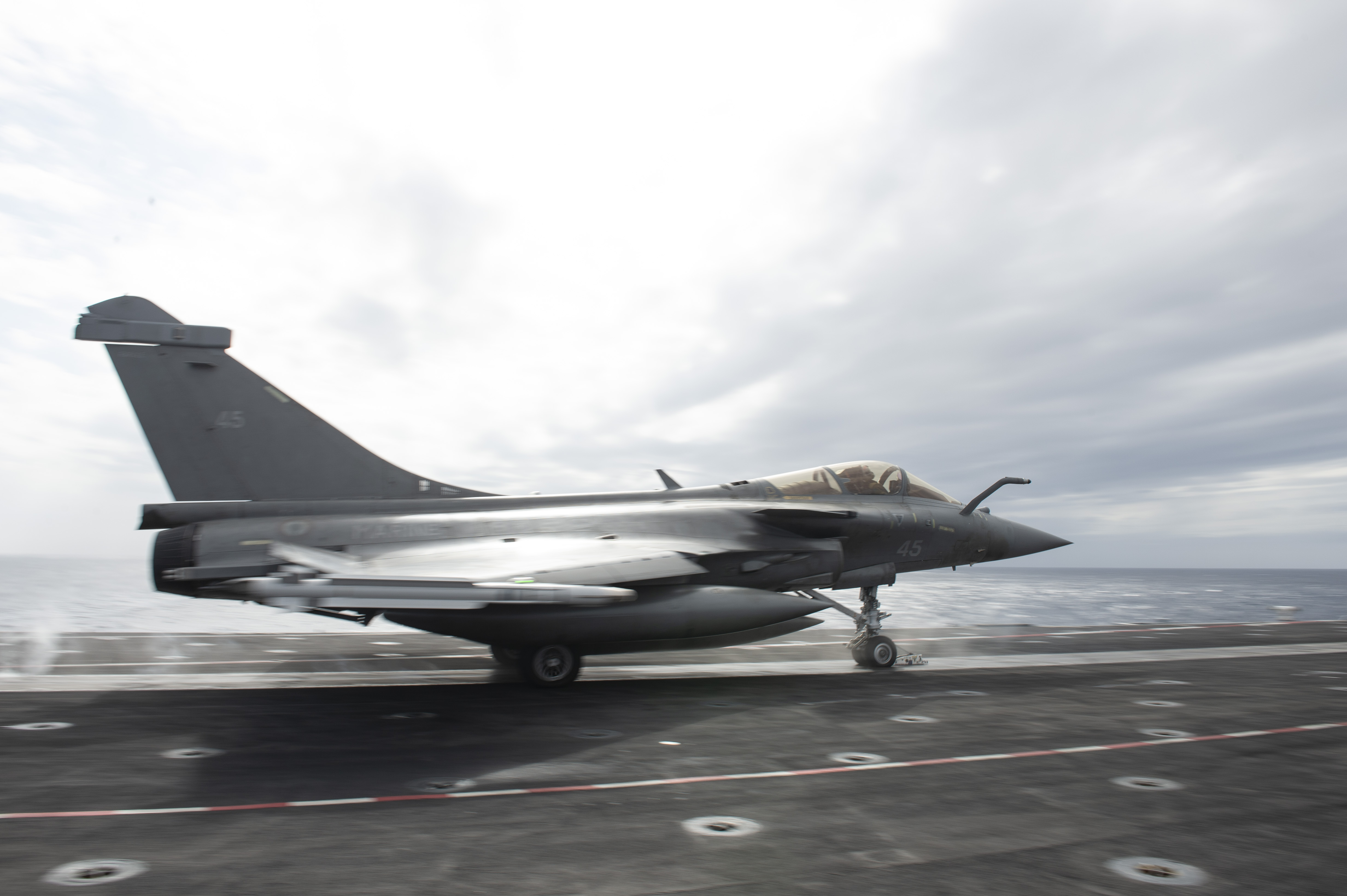 French Dassault Rafale M fighter jet launches from the flight deck aboard the French aircraft carrier Charles De Gaulle (R 91) while conducting interoperability exercises with the aircraft carrier USS Dwight D. Eisenhower (CVN 69).