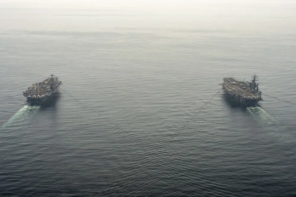  The aircraft carriers USS Dwight D. Eisenhower (CVN 69), right, and USS Harry S. Truman (CVN 75) transit the Arabian Sea March 18, 2020. 