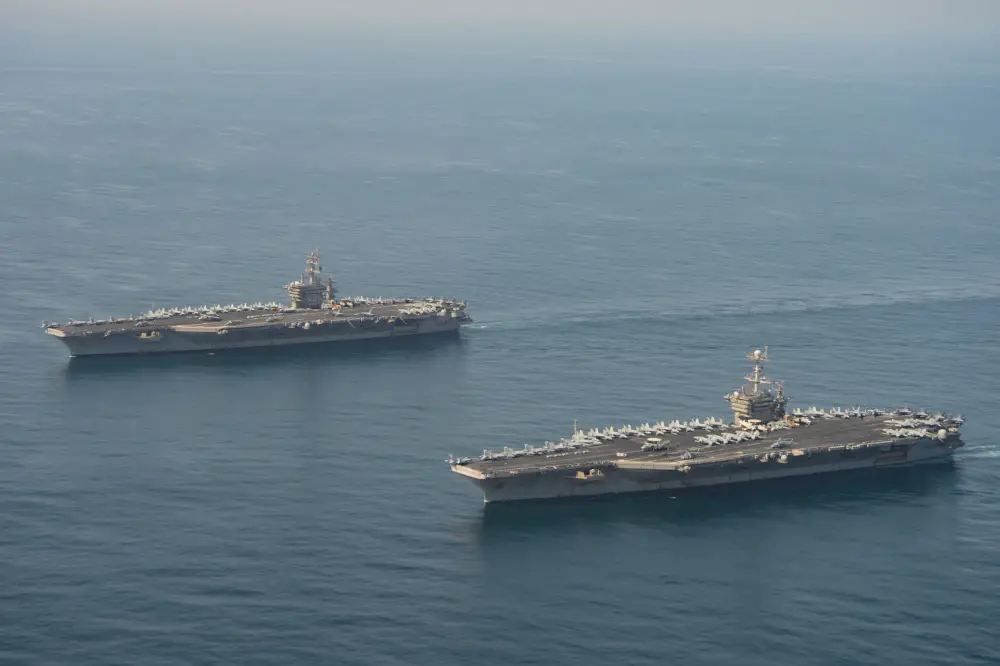 The aircraft carriers USS Dwight D. Eisenhower (CVN 69), left, and USS Harry S. Truman (CVN 75) transit the Arabian Sea March 18, 2020.