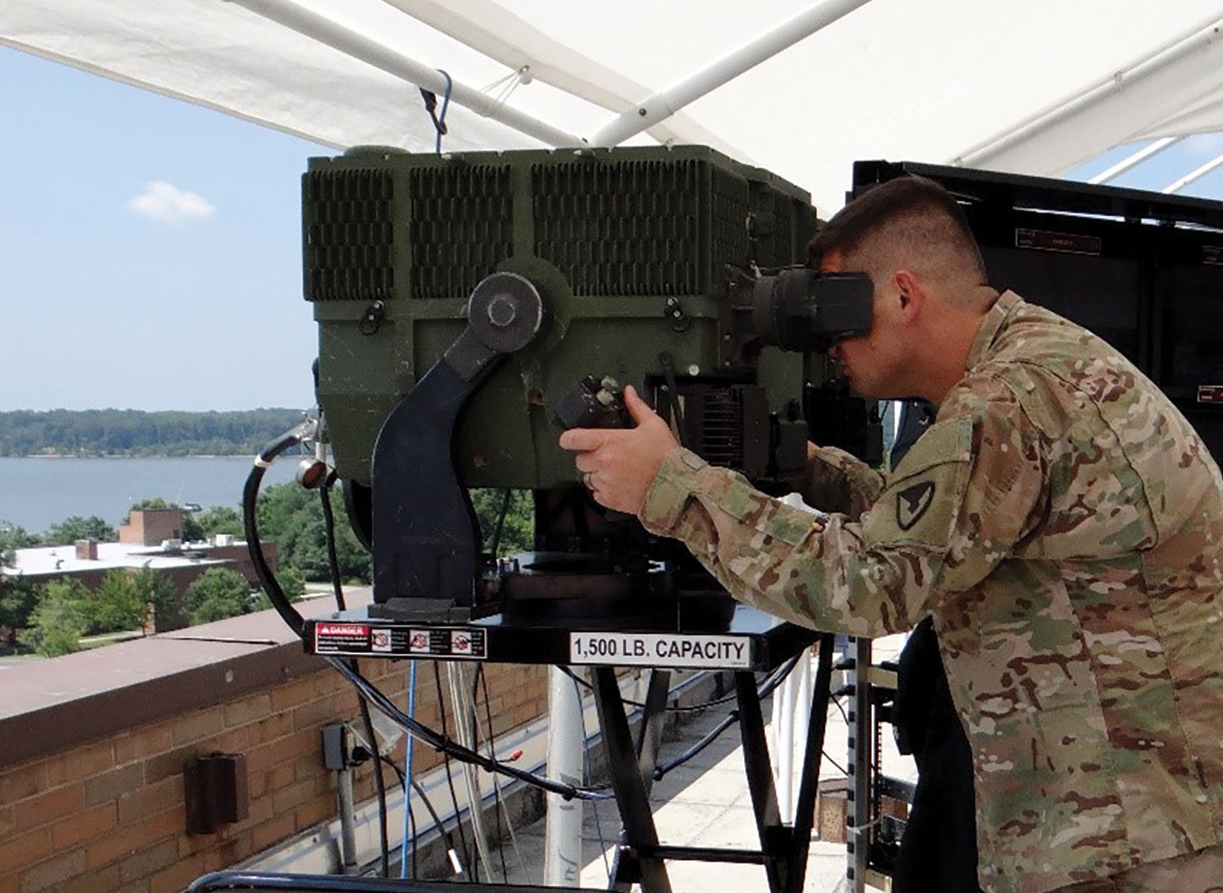A soldier views the 3rd GEN FLIR system's capabilities. The system enables greater speed, precision and range in the targeting process.