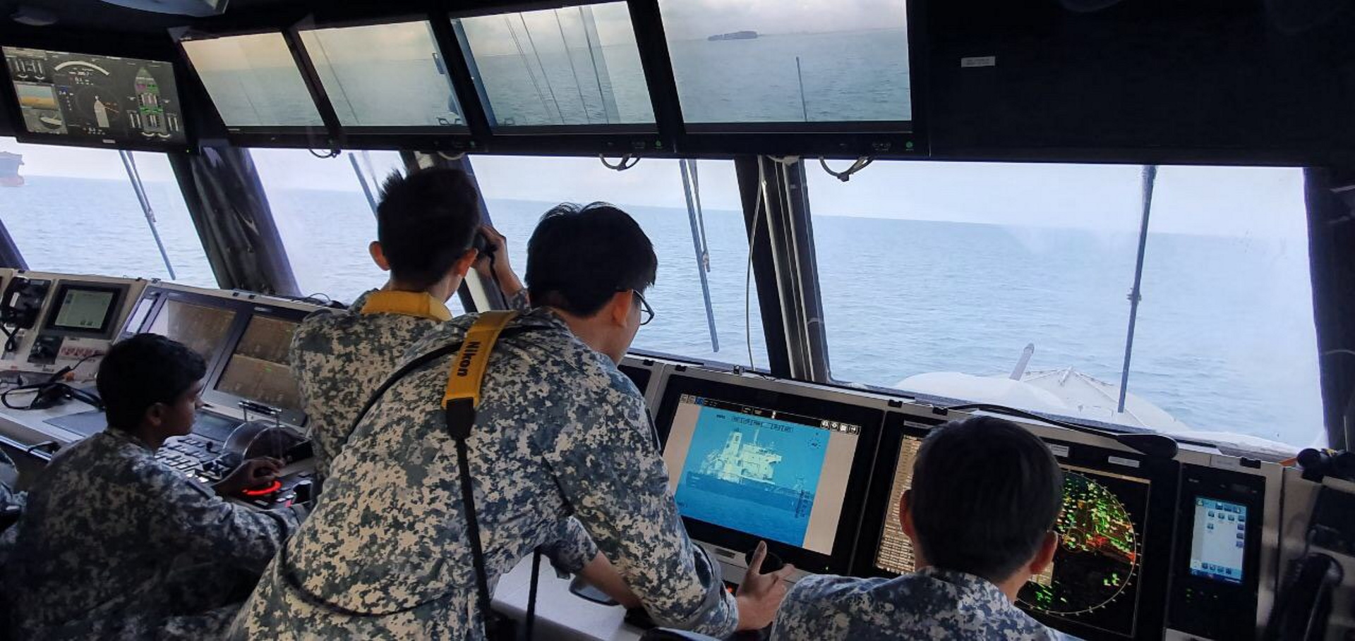 The Republic of Singapore Navy  personnel on board RSS Independence, monitoring the Sam Jaguar.
