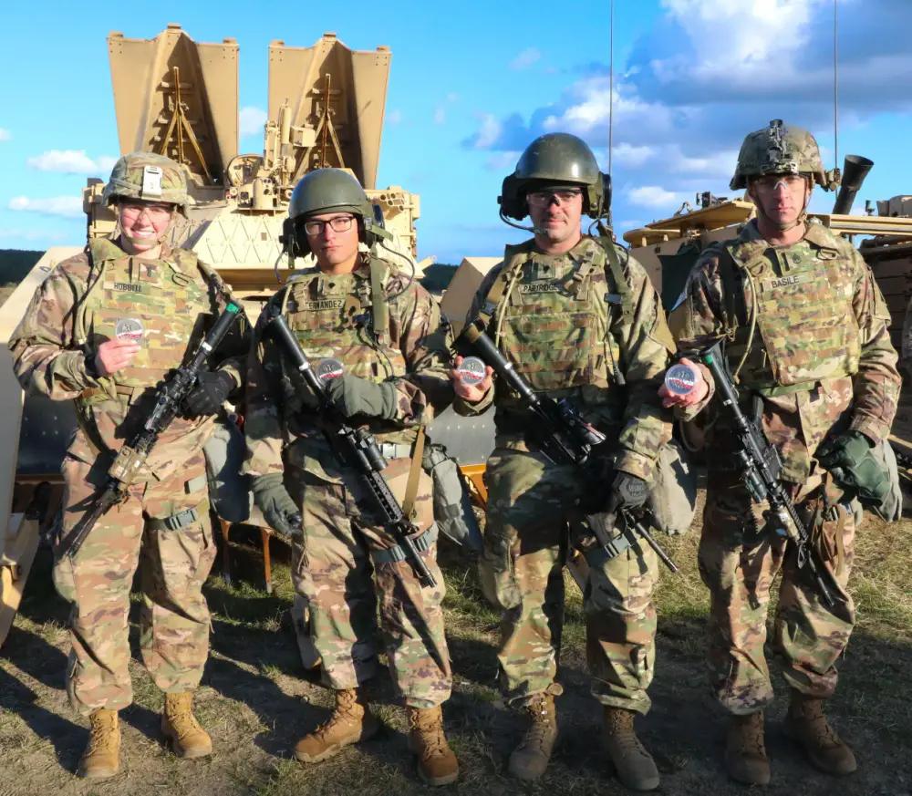 U.S. Army soldiers from Alpha Company, 9th Brigade Engineer Battalion, 2nd Brigade Combat Team, pose with coins presented to them by Andrzej Duda, the President of Poland, on March 11, 2020, in Drawsko Pomorskie.