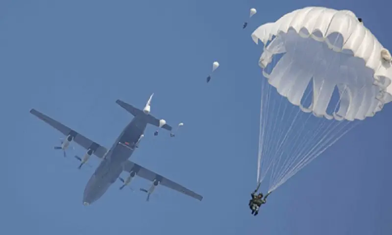 Chinese PLA Air Force Paratroopers hold fully armed parachute jump exercises