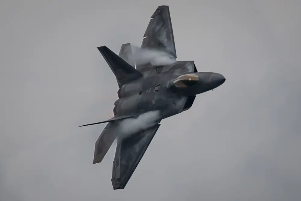 U.S. Air Force Maj. Josh Gunderson, F-22 Demonstration Team pilot, performs during an aerial demonstration at the Singapore Airshow 2020 near the Changi Exhibition Center Feb. 11, 2020. The F-22 Demo Team travels to air shows all across the world to showcase the performance and capabilities of the world's premier 5th-generation fighter. (U.S. Air Force photo by 2nd Lt. Sam Eckholm)