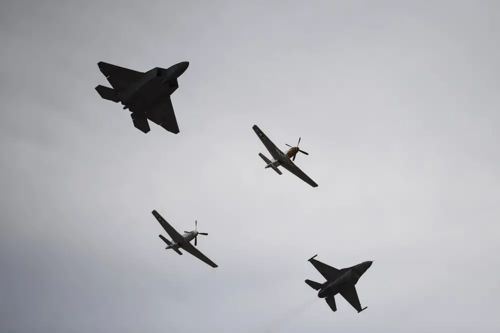 A U.S. Air Force F-22 Raptor, assigned to the F-22 Demonstration Team, two P-51 Mustangs and an F-16 Viper, assigned to the F-16 Viper Demonstration Team, fly in formation during the 2020 Heritage Flight Training Course at Davis-Monthan Air Force Base, Arizona, Mar. 1, 2020. HFTC displays modern fighter and attack aircraft flying alongside World War II, Korea and Vietnam-era planes in a dramatic display of our nation's air power history. (U.S. Air Force photo by Senior Airman Mya M. Crosby)
