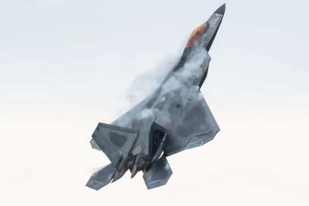 U.S. Air Force Maj. Josh Gunderson, F-22 Raptor Demonstration Team commander and pilot, pulls into a maximum vertical climb during an aerial demonstration at Joint Base Langley-Eustis, Va., March 30, 2020. Maj. Gunderson has over 1,500 hours flying both the F-15 Eagle and F-22 Raptor and is in his first year as commander of the F-22 Raptor Demo Team. (U.S. Air Force photo by Lt. Sam Eckholm)