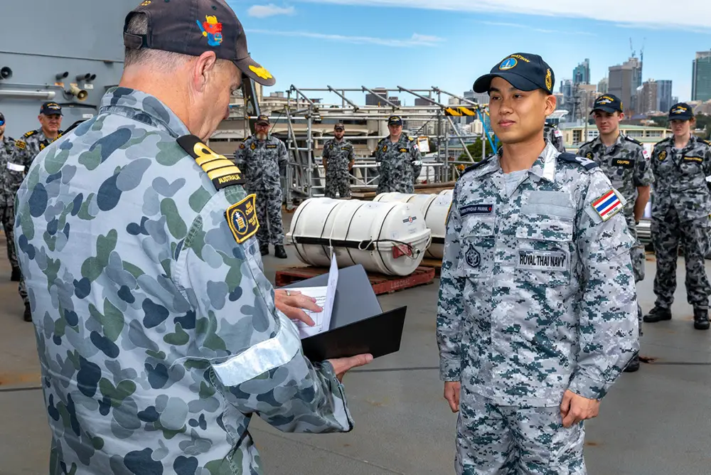 Midshipman Theeratiphong Pannil of the Royal Thai Navy is promoted to the rank of Sub Lieutenant by Commanding Officer HMAS Choules, Commander Scott Houlihan RAN, CSM at a ceremony held aboard HMAS Choules, Garden Island, Sydney.