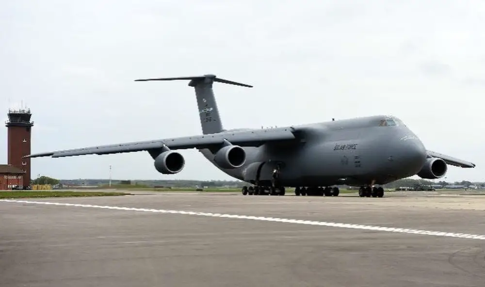 A U.S. Air Force C-5 Super Galaxy assigned to the 9th Airlift Squadron, Dover Air Force Base, Delaware, arrives at RAF Mildenhall, England, April 18, 2020. The 9th AS and the 727th Air Mobility Squadron, based at RAF Mildenhall, took part in a medical cargo mission which involved delivering COVID-19 test kits and other equipment to Accra, Ghana, to be distributed throughout the U.S. African Command area of responsibility. (U.S. Air Force photo by Senior Airman Brandon Esau)