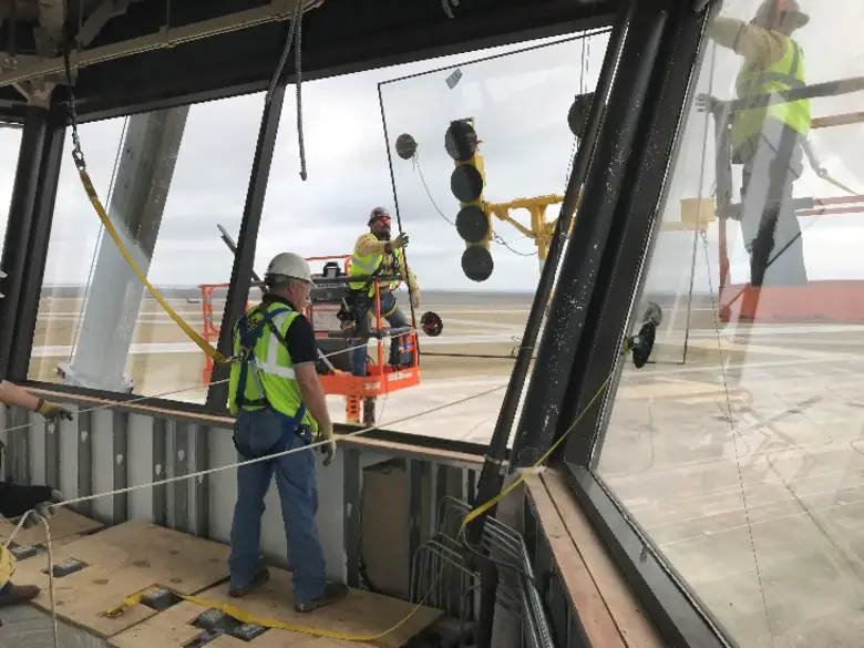 In Feb. 2019, four months after Hurricane Michael devastated Tyndall Air Force Base, Fla., contractors supporting hurricane recovery efforts as part of the AFCAP IV contingency contract installed the final glass panel in the base control tower. The Air Force Contract Augmentation Program is a rapid response contract tool managed and serviced through the AFIMSC enterprise. The AFCAP V, an eight-year, $6.4 billion contingency support contract, was recently awarded to eight firms by the Air Force. (Courtesy Photo)