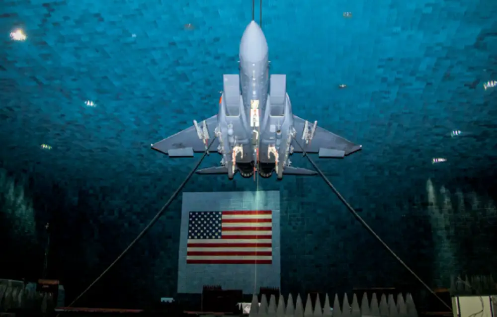 An F-15E Eagle is suspended from the ceiling at the Benefield Anechoic Facility during its first phase of testing of the Eagle Passive/Active Warning and Survivability System (EPAWSS) at Edwards Air Force Base, California, May 8, 2019. A testing phase began recently and is currently under way. (Air Force photo by Ethan 