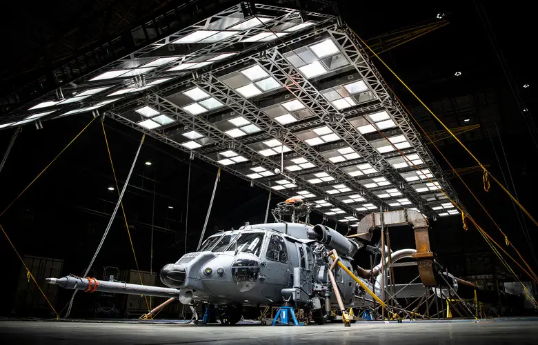 An HH-60W Jolly Green sits under bright lights used to create heat in the McKinley Climatic Lab March 19 at Eglin Air Force Base, Fla.  The Air Force's new search and rescue helicopter and crews experienced temperature extremes from 120 to -60 degrees Fahrenheit as well as torrential rain during the month of testing.  The tests evaluate how the aircraft and its instrumentation, electronics and crew fare under the extreme conditions it will face in the operational Air Force.  (U.S. Air Force photo/Samuel King Jr.)