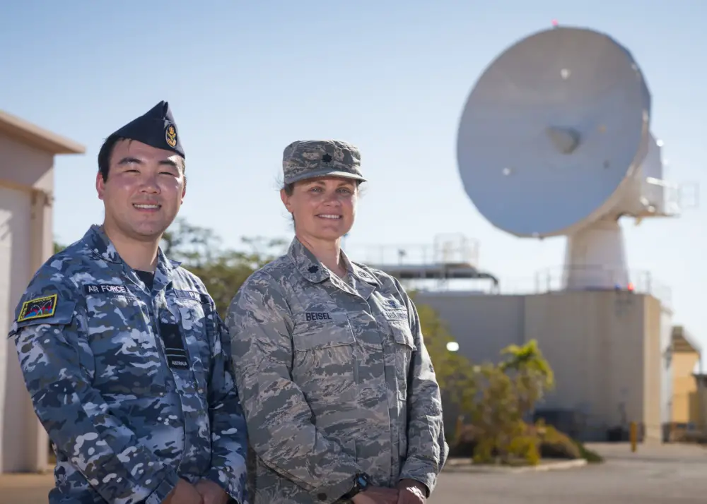 Royal Australian Air Force Flight Lt. James Pak, RAAF No. 1 Remote Sensor Unit, and U.S. Air Force Lt. Col. Jennifer Beisel, space liaison officer , 21st Operations Group, 21st Space Wing, work together to monitor and operate a U.S.-owned C-Band space surveillance radar system at NCS Harold E. Holt, near Exmouth, Australia. Strategically located to cover both the southern and eastern hemisphere, the C-Band radar provides tracking and identification of space assets and debris for the U.S. space surveillance network. (U.S. Navy photo by Mass Communication Specialist 2nd Class Jeanette Mullinax)