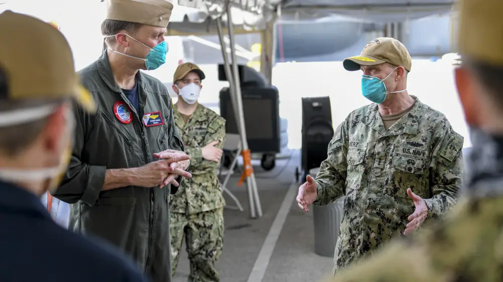 Vice Admiral Bill Merz, commander, U.S. 7th Fleet, meets with the staff and crew of the aircraft carrier USS Theodore Roosevelt (CVN 71). Merz arrived in Guam to assess and support the ongoing recovery efforts of the crew of USS Theodore Roosevelt, April 5. US Navy Photo by Mass Communication Specialist 1st Class Julio Rivera
