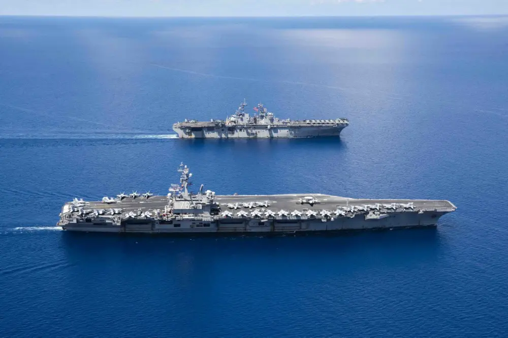  USS Ronald Reagan (CVN 76) and USS Boxer (LHD 6) sail in formation while conducting security and stability operations in the U.S. 7th Fleet area of operations. U.S. 7th Fleet is the largest numbered fleet in the world, and the U.S. Navy has operated in the Indo-Pacific region for more than 70 years, providing credible, ready forces to help preserve peace and prevent conflict. (U.S. Navy photo by Mass Communication Specialist 2nd Class Erwin Jacob V. Miciano)