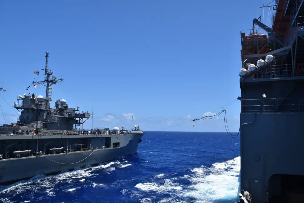 U.S. 7th Fleet flag ship USS Blue Ridge (LCC 19), left, and the Lewis and Clark-class dry cargo and ammunition ship USNS Richard E. Byrd (T-AKE 4) conduct an emergency breakaway drill after the two ships completed a replenishment-at-sea. (U.S. Navy photo by Charles Baker)