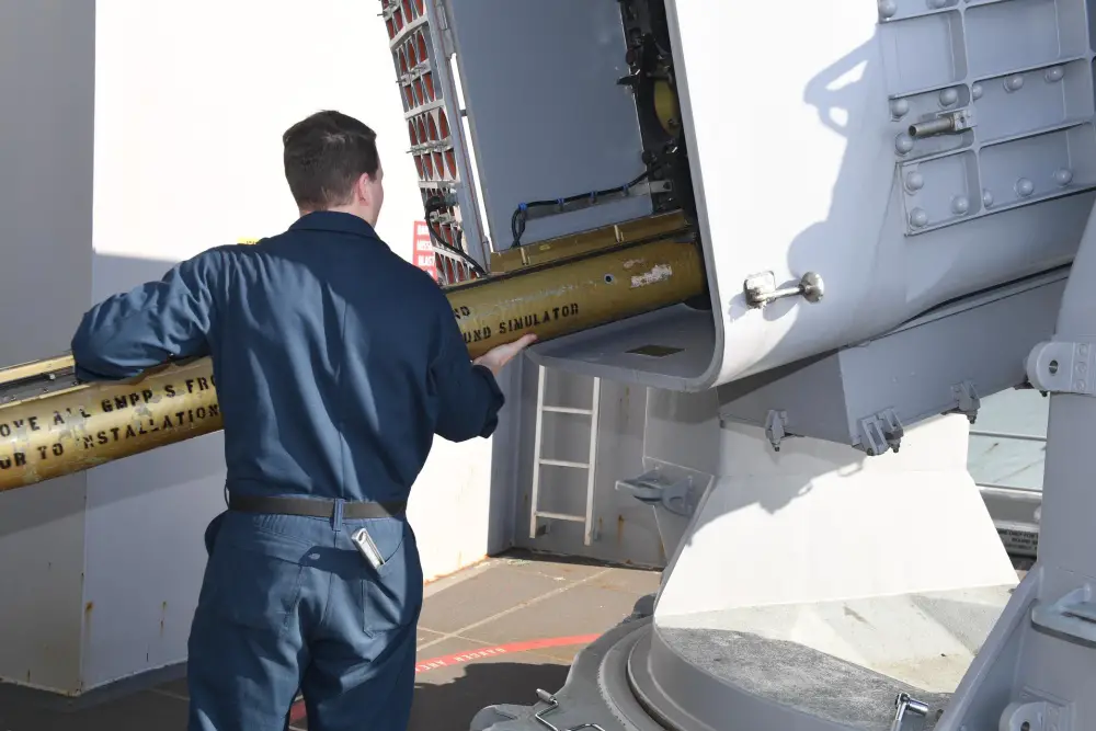 Fire Controlman 3rd Class Caleb Gallaher, from Portsmouth, Virginia, assigned to USS Gerald R. Ford's (CVN 78) combat systems department, unloads a rolling airframe training missile on Ford's (RAM) weapon sponson April 2, 2020, after completing sea based developmental testing (SBDT) of the integrated combat system. 