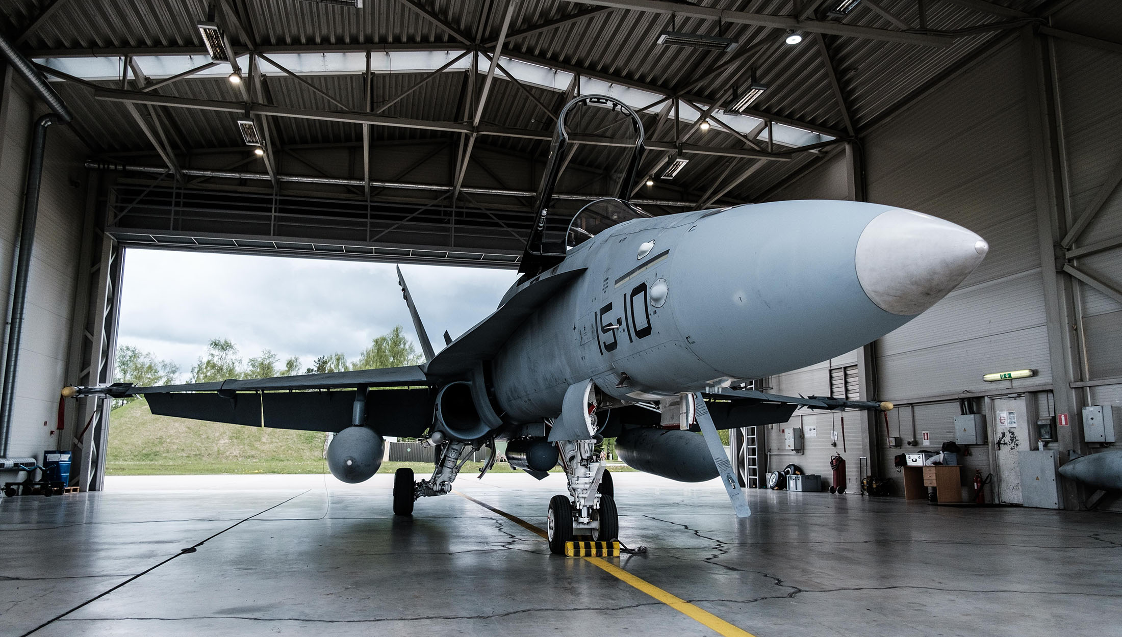 A Spanish Air Force F/A-18 Hornet waits in a hangar at Å iauliai Air Base in Lithuania.