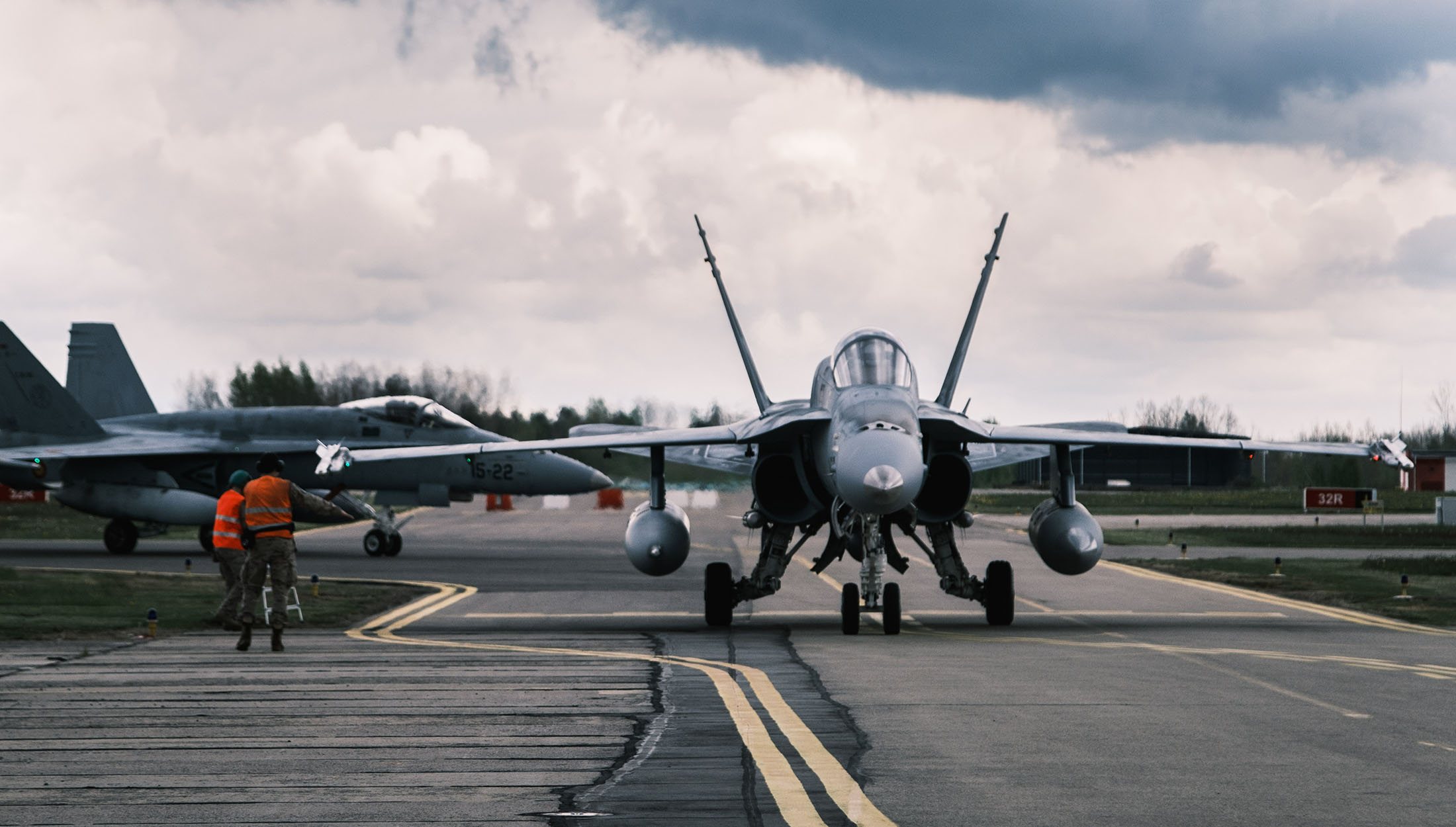 Spanish Air Force F/A-18 Hornets return to Å iauliai Air Base in Lithuania following a training scramble. 